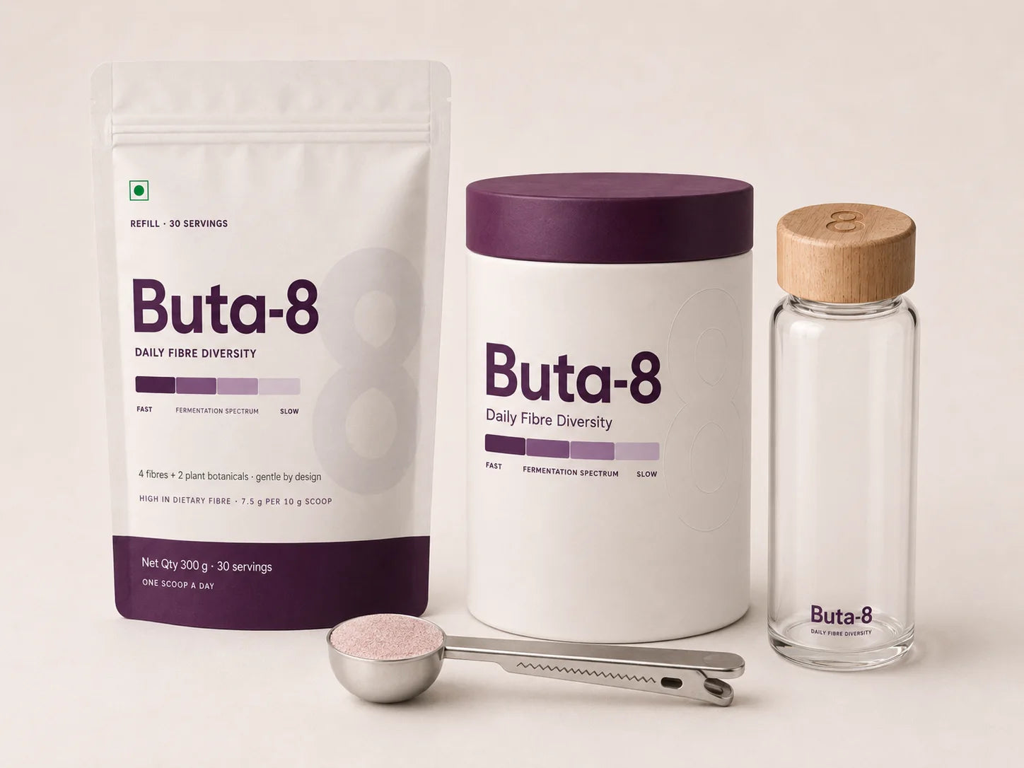 Buta-8 refill pouch, steel scoop-clip and glass shaker, shown with the steel canister that follows later